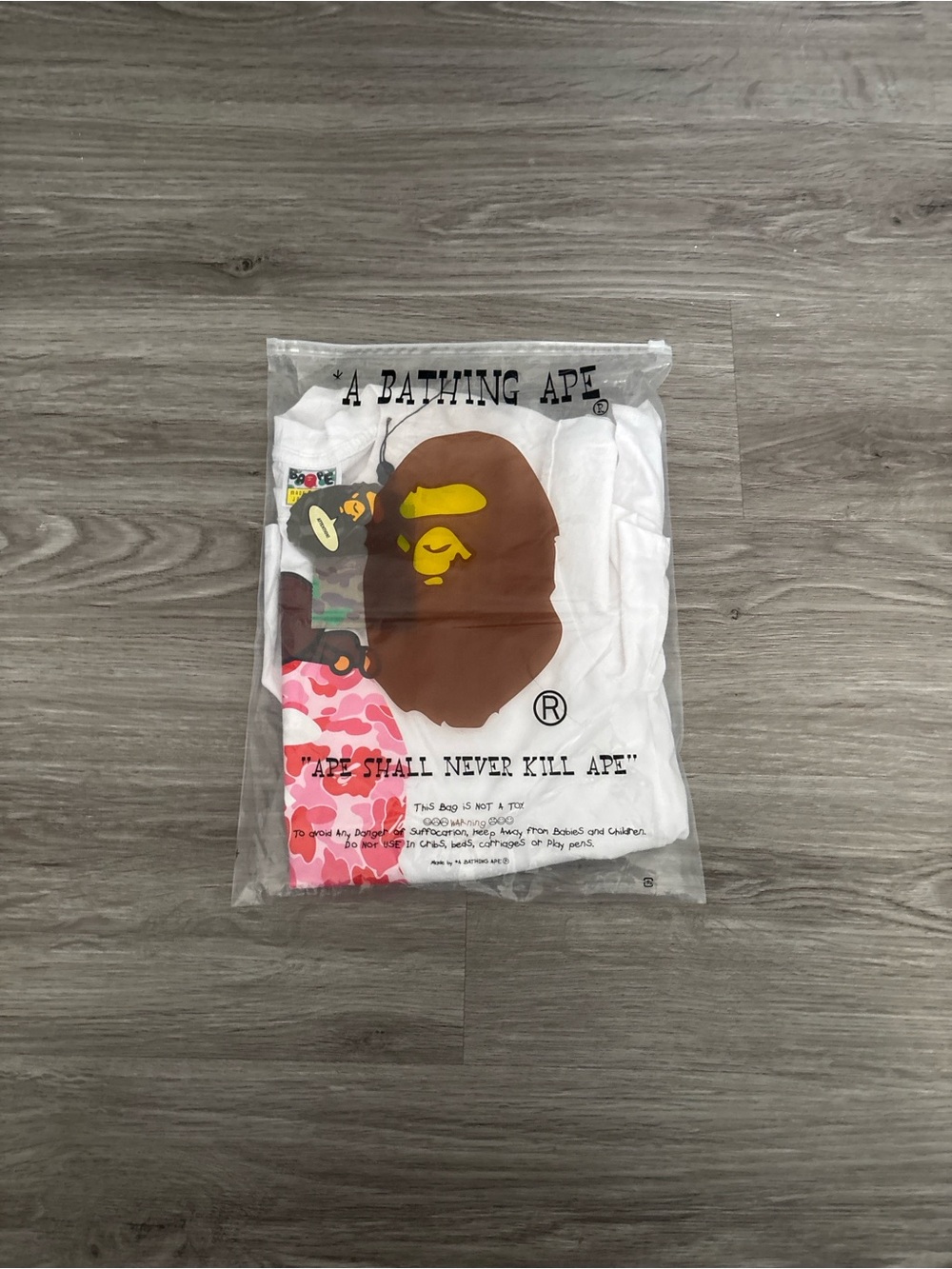 Bape White Tee with Brown & Yellow Ape Head and Pink Camo Accents